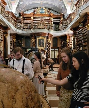 oxford students visiting pragues klementinum library hall