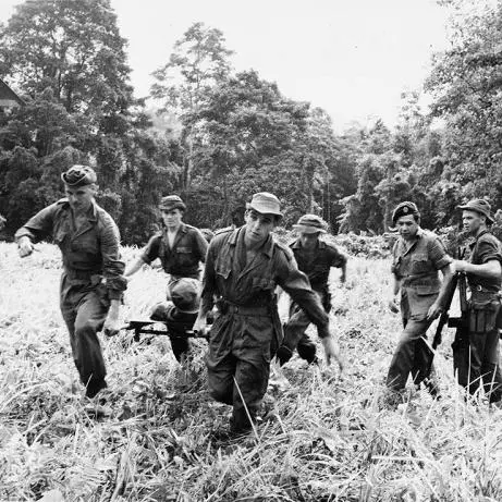 cd events the malayan emergency 1948 1960 men of 22 special air service regiment practice carrying a casualty to a waiting helicopter during a training exercise in a jungle 