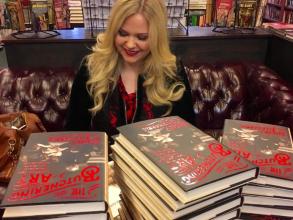 Dr Lindsey Fitzharris signing her book
